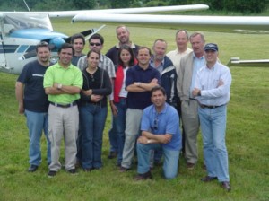 Claudio, at right wearing hat, with pilot friends