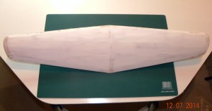 Topside of wing with carved wingtips and filler prior to sanding.