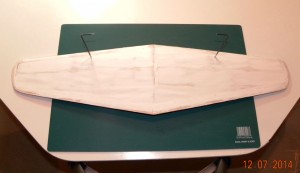 Underside of wing with carved wingtips and filler prior to sanding.