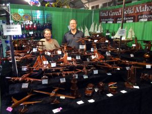 Dennis King (l) and Wade Wheeler (r) manning their booth at the New York State Fair