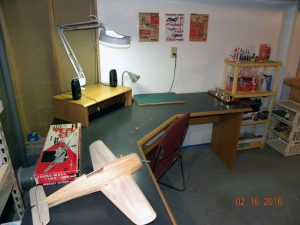 Old computer desk repurposed for model building. The two 'wings' on the desk will allow for the simultaneous building of two kits! And the center shelf (with small speakers and magnifying light) allow me to connect and play my iPad while building!