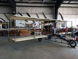 An early Curtiss biplane in the restoration workshop.