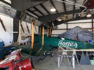 All available space in the hanger is utilized working on the aircraft.