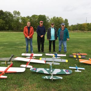 Mike O'Neill, Steve Dwyer, Chuck Smith, and George Eckhardt with their full squadron of control line planes ready to fly.